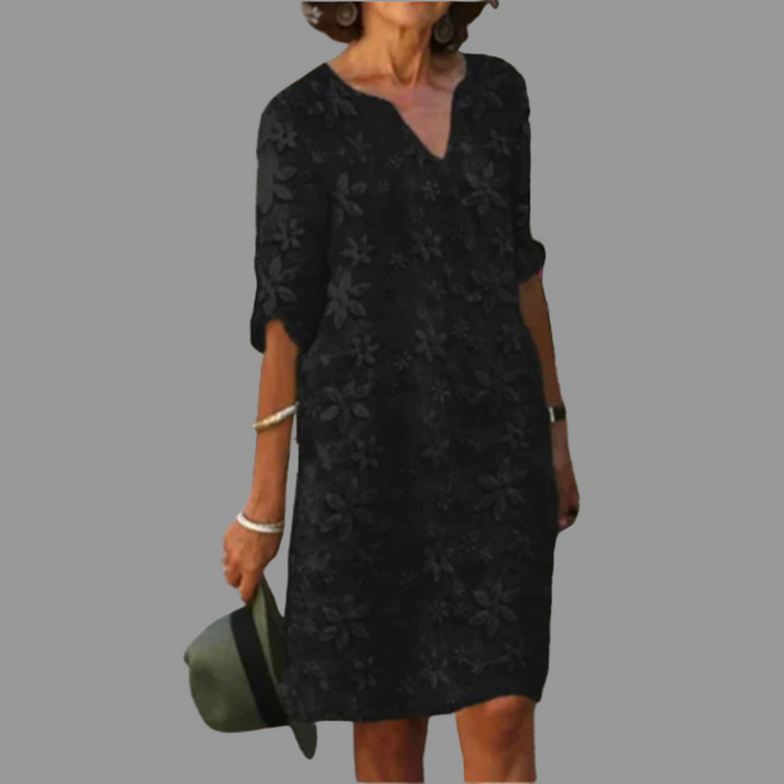 Chic women's printed floral midi dress with V-neckline. Versatile for relaxed summer fashion & elegant events.