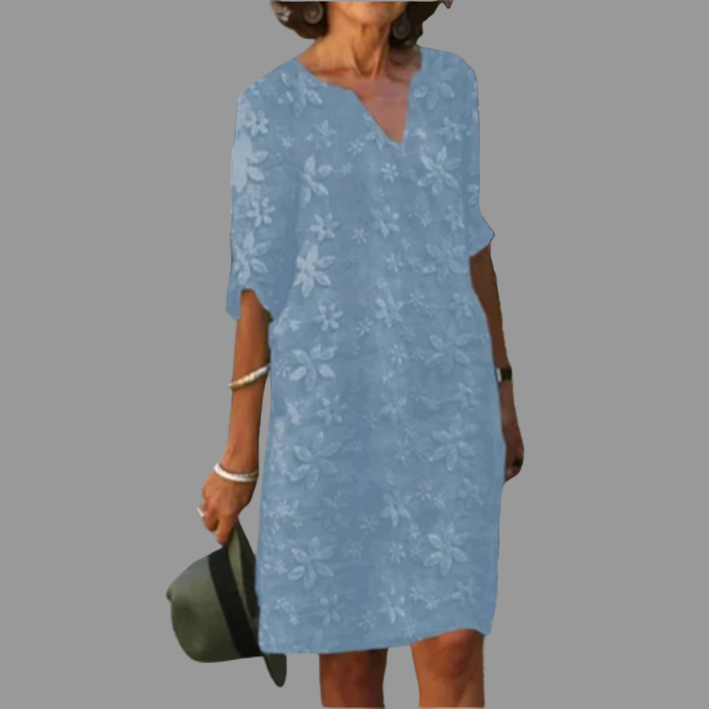 Stylish women's V-neck midi dress with a beautiful floral pattern. Ideal for versatile fashion, from casual to dressy.