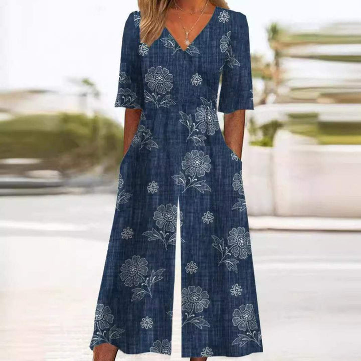 Elegant women's floral wide-leg jumpsuit with V-neck and elbow sleeves, perfect bohemian summer resort wear.