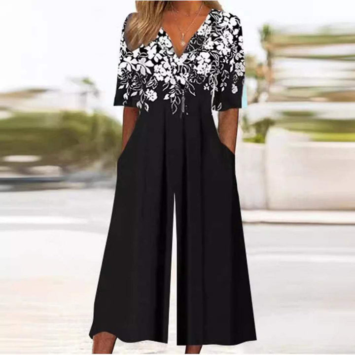 Women's bohemian floral wide-leg palazzo jumpsuit, featuring a flattering V-neck and stylish elbow sleeves.
