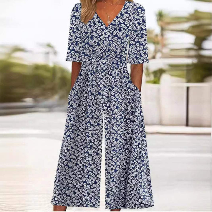 Stylish women's elegant floral wide-leg jumpsuit with V-neck and elbow sleeves, a bohemian palazzo for summer.