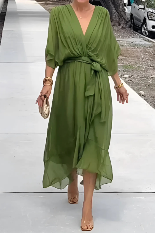 Close-up of elegant Seren style maxi dress fabric, showing flowing drape. Ideal women's formal wear or holiday dress.