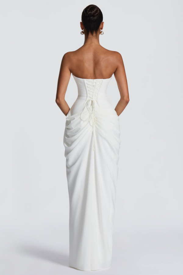 Charming women's wedding guest dress, elegant and flowing maxi length design.
