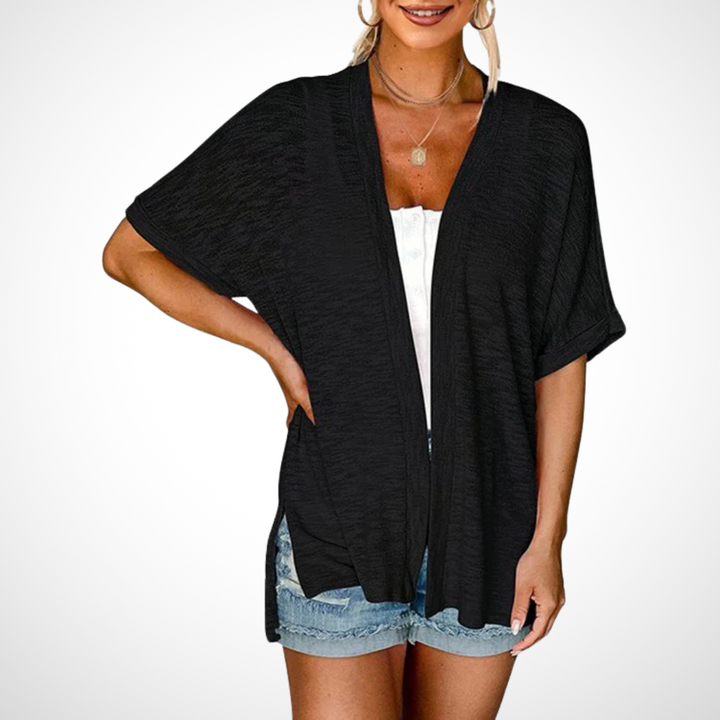 Lightweight white flowing open front short sleeve cardigan for women, a comfortable summer top for elegant casual wear.
