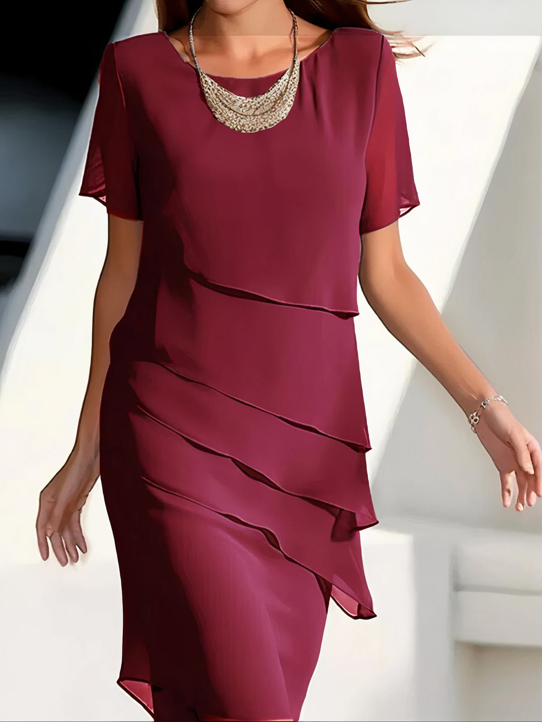 Elegant women's flowing tiered dress, perfect for spring/summer occasionwear, offering a relaxed and versatile fit.
