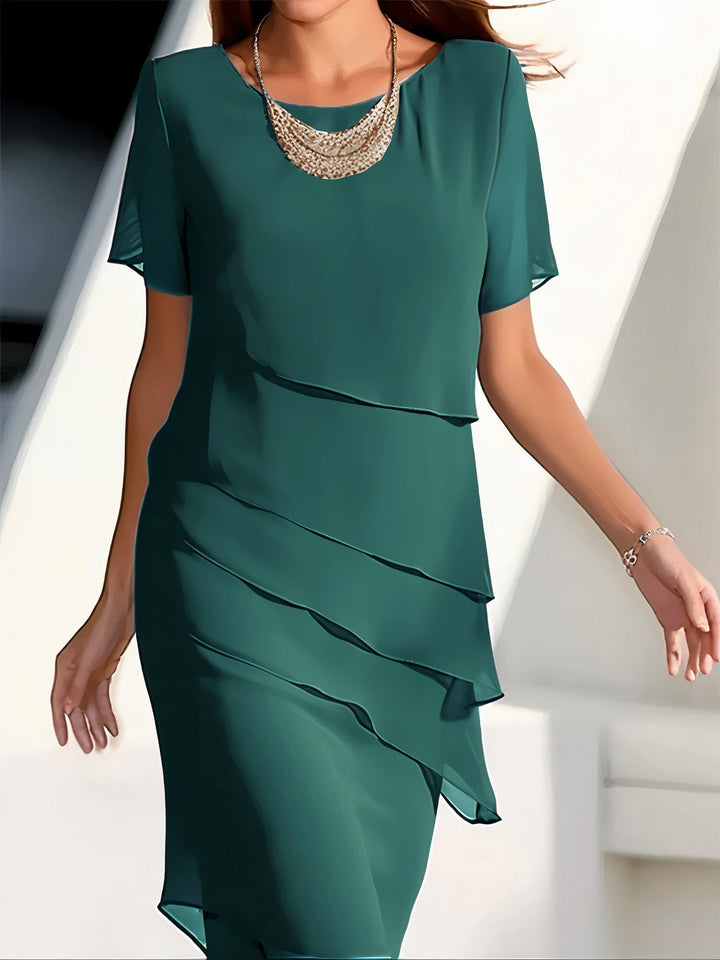 Relaxed fit women's elegant tiered dress, flowing beautifully for versatile spring & summer occasionwear, comfortable style.