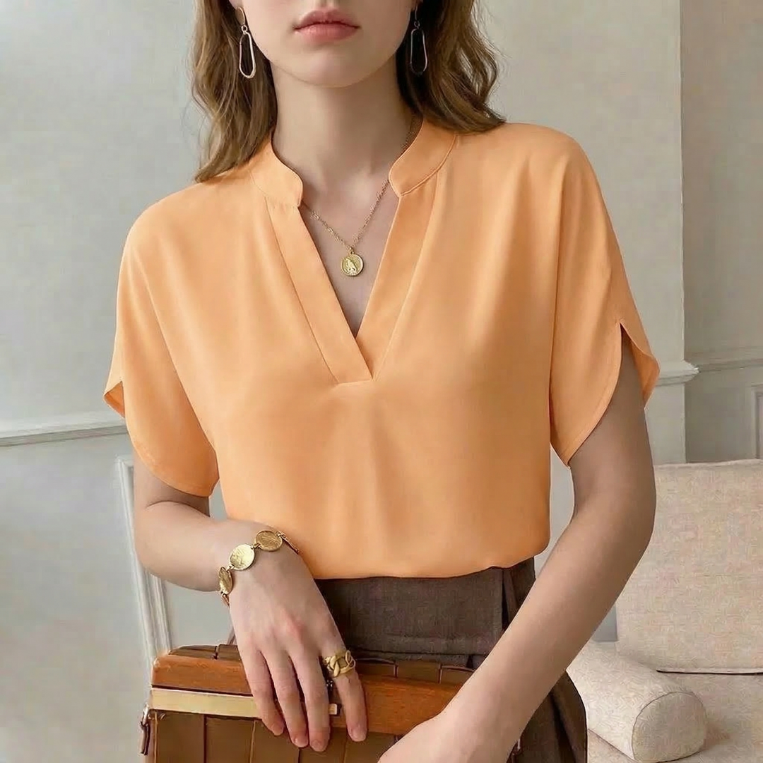 Elegant women's flowy blouse, perfect for versatile sophisticated style. Long sleeve top for office or casual wear.