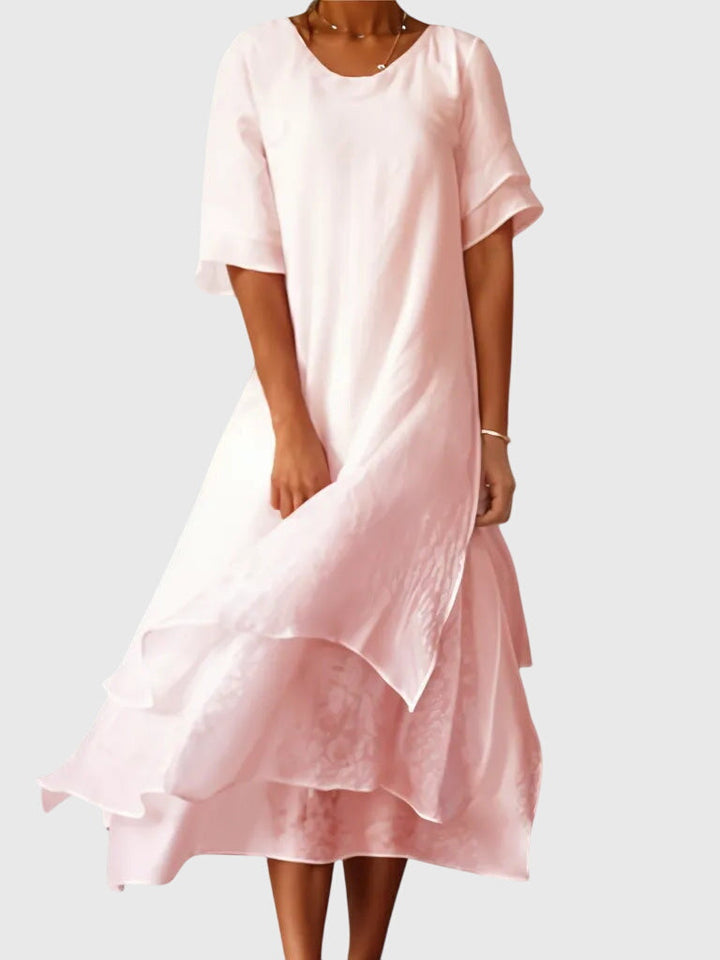 Elegant women's flowy midi dress, perfect for summer. Versatile day-to-night style with a comfortable, flattering fit.