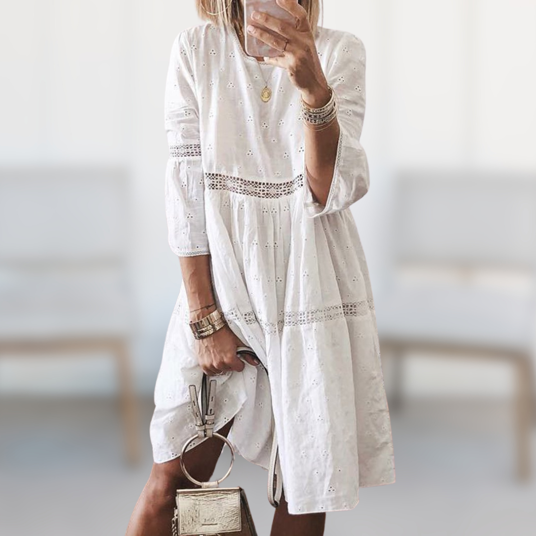Chic women's midi summer dress featuring a stylish round neck and flowy silhouette for effortless elegance.