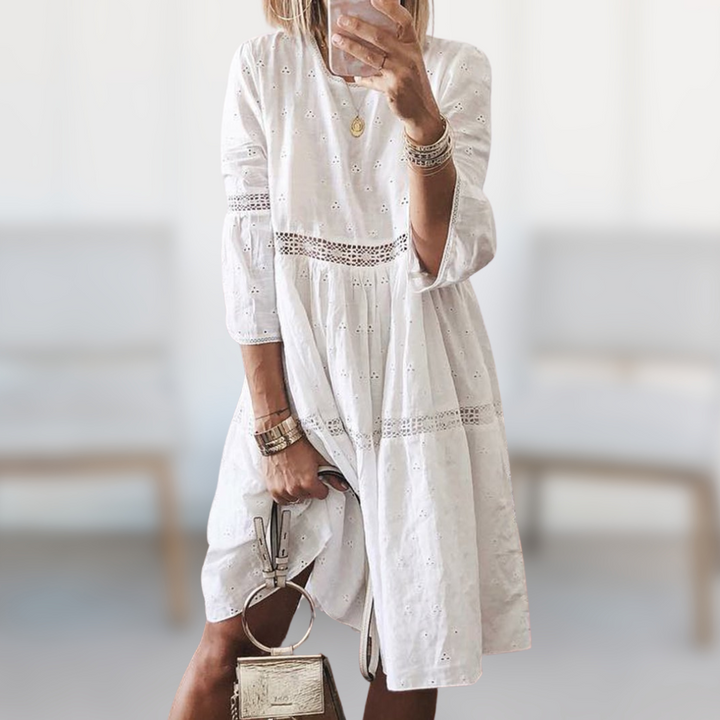 Chic women's midi summer dress featuring a stylish round neck and flowy silhouette for effortless elegance.