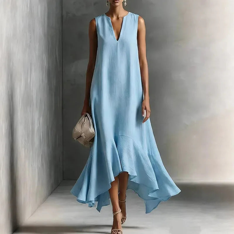 Comfortable women's sleeveless V-neck sundress. Flowy design and ruffle hem, ideal for summer and beachwear.