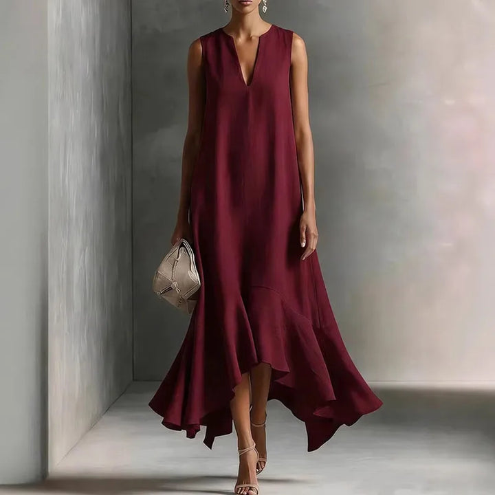 Beautiful women's elegant V-neck sundress, flowy fabric, and a pretty ruffle hem. Perfect sleeveless summer dress.