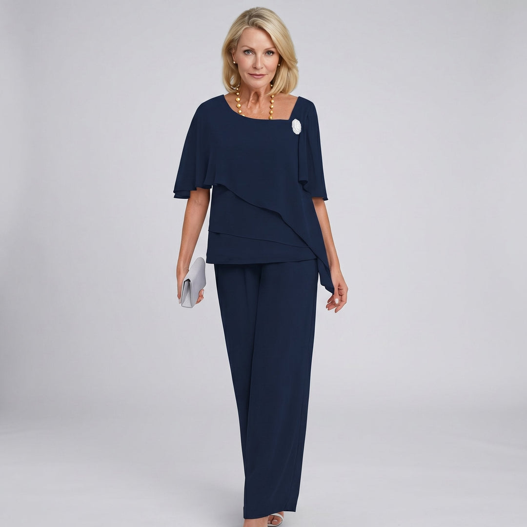 Formal women's wide leg pant set with elegant flutter sleeves. Two-piece draped design, ideal for sophisticated occasion wear.