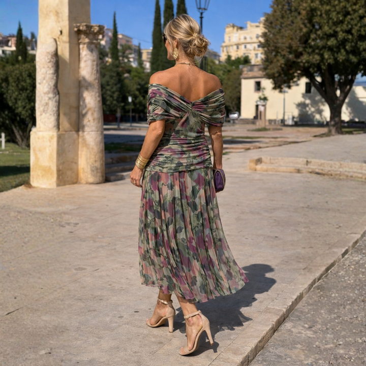 Women's V-neck midi dress with gathered front, flutter sleeves. Perfect as a wedding guest outfit.