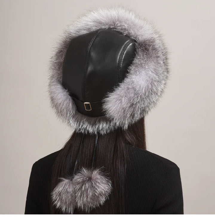 Detailed shot of the soft, genuine fox fur on a women's winter hat, emphasizing quality