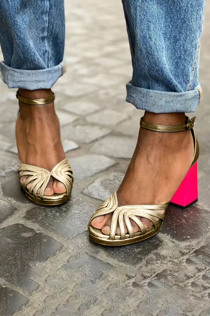 Chic women's block heel sandals in gold, featuring an open toe & secure ankle strap; versatile dress or party footwear.