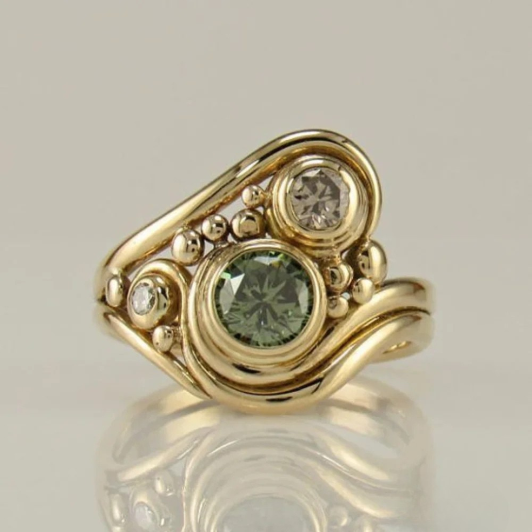 Elegant Women's Gold Plated Ring with vibrant Green Zirconia stone, a stylish statement jewelry piece.
