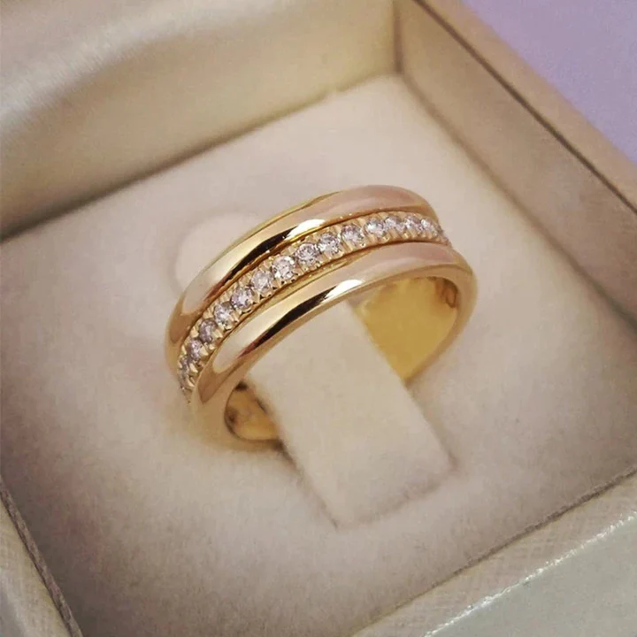Elegant women's gold ring with sparkling zirconia inlay, perfect as a dainty, timeless fashion accessory or gift.