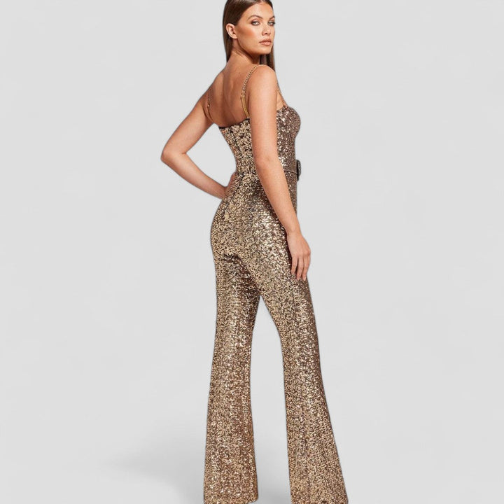 Glamorous woman in a gold sequin jumpsuit, a perfect party outfit for evening wear. Shimmering design.