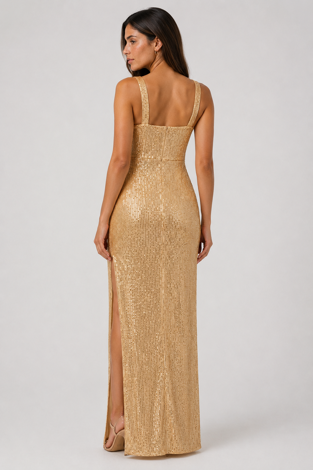 Close-up of the elegant vertical pattern on a gold sleeveless women's maxi dress, highlighting fabric detail.