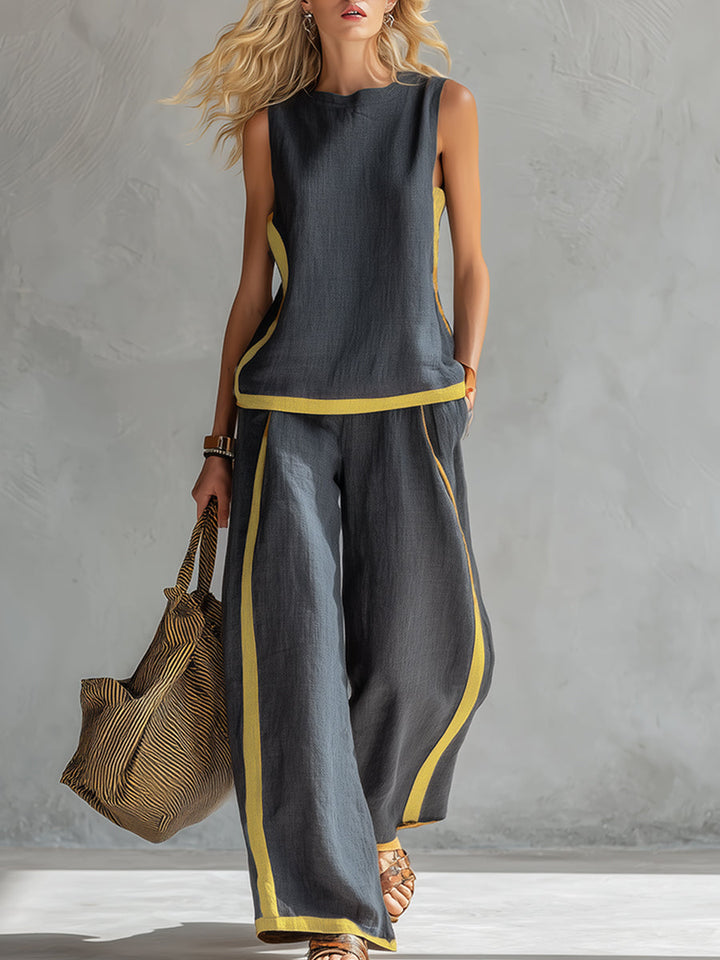 Elegant women's gray vest & loose fit pants set. Stylish two-piece matching outfit for casual or workwear.