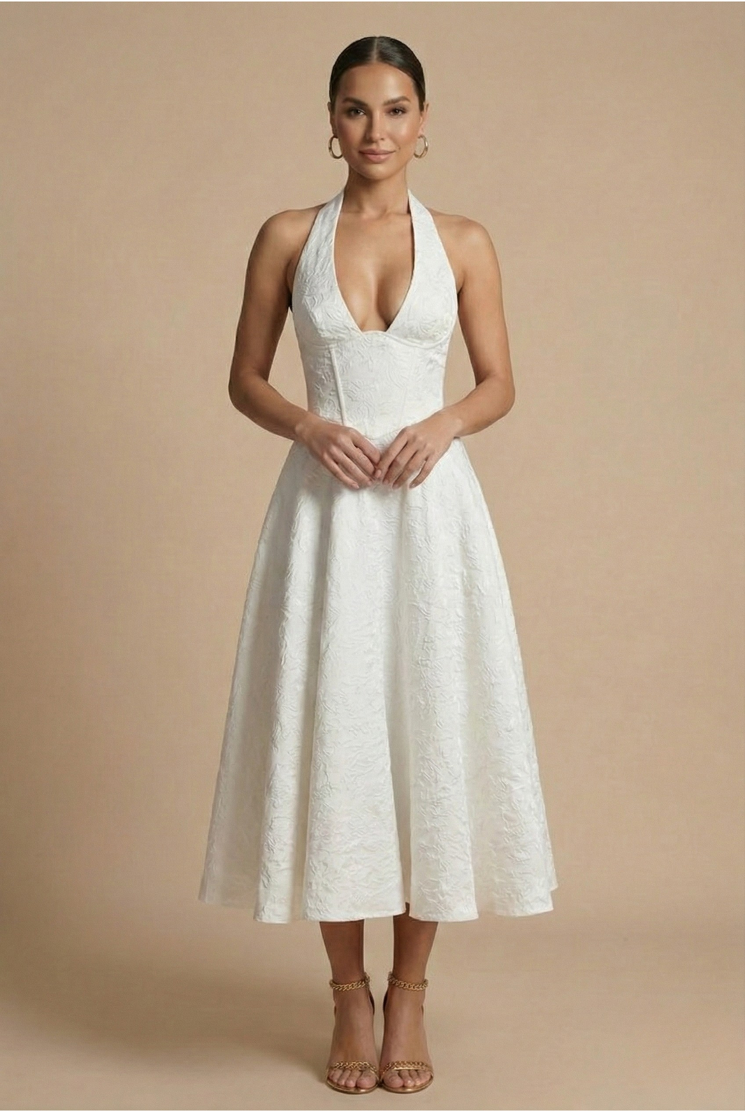 Full-length view of a women's formal halter corset A-line midi dress, showcasing its chic design.