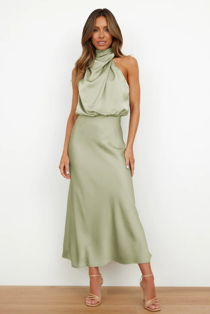 Elegant women's halter evening gown, floor-length with an open back, perfect for formal occasions & galas.