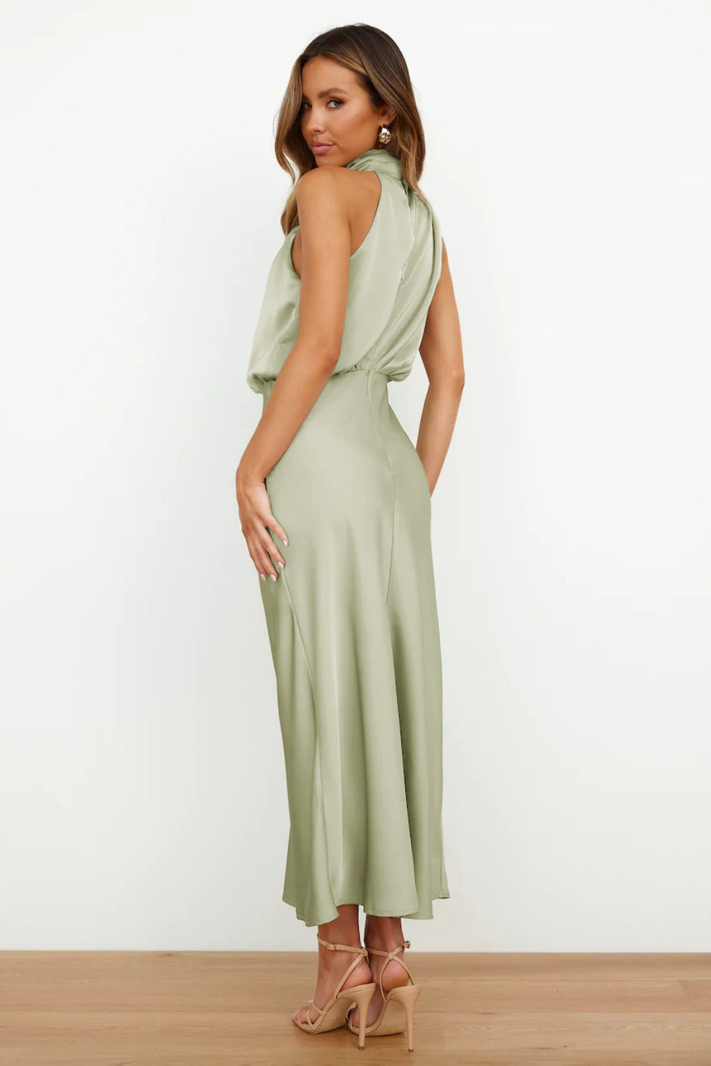 Beautiful open back evening gown, floor-length halter style, ideal for prom, weddings, or formal events.