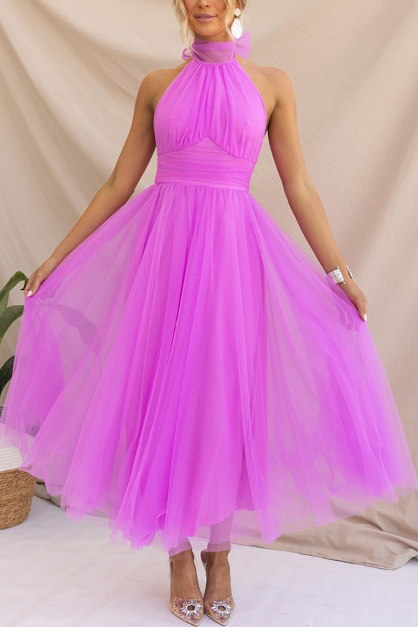 Elegant women's halter maxi wedding guest dress. Flowy evening gown, perfect for formal occasions & parties.