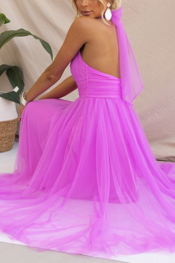 Full-length view of an elegant women's halter maxi wedding guest dress. Flowy evening gown for formal events.