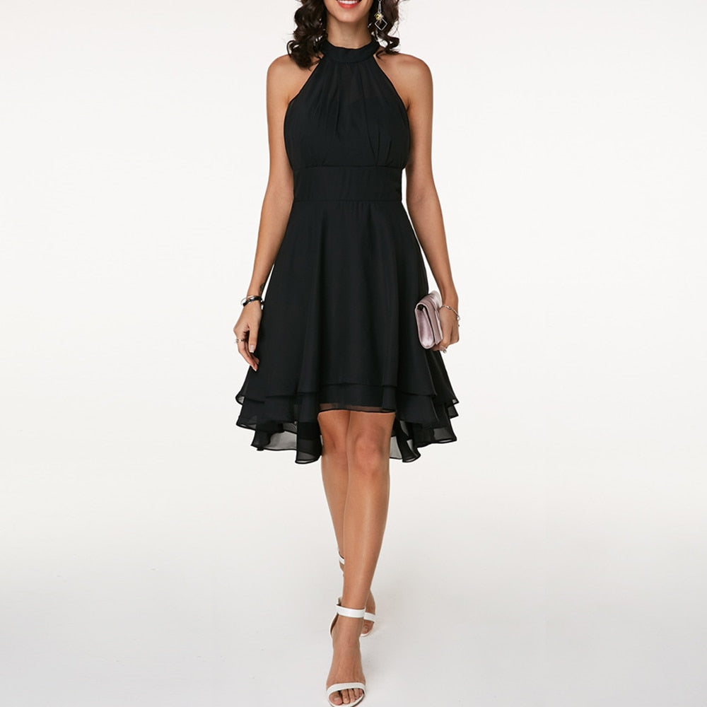 Stylish women's elegant halter mini dress, featuring a flattering fluid drape for evening wear.
