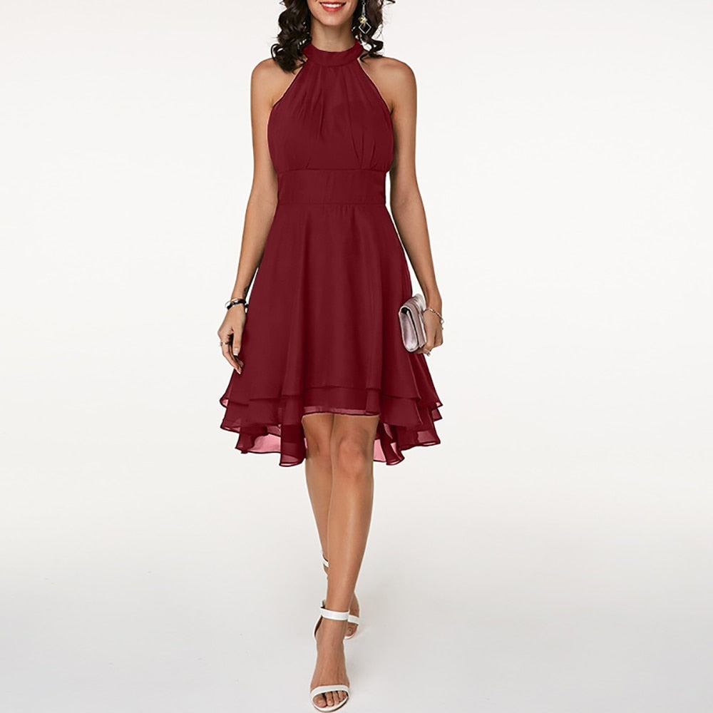 Close-up of an elegant women's halter mini dress, showcasing the beautiful fluid drape detail.