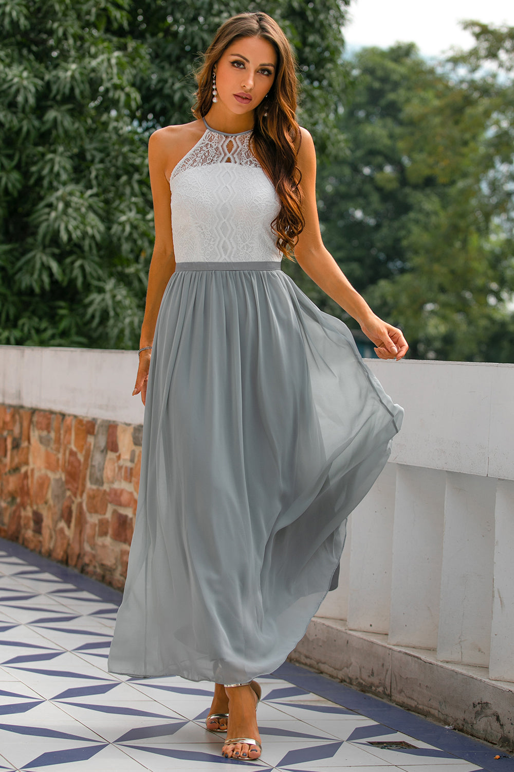 Elegant women's halter neck maxi dress in navy blue, perfect for wedding guests & formal events