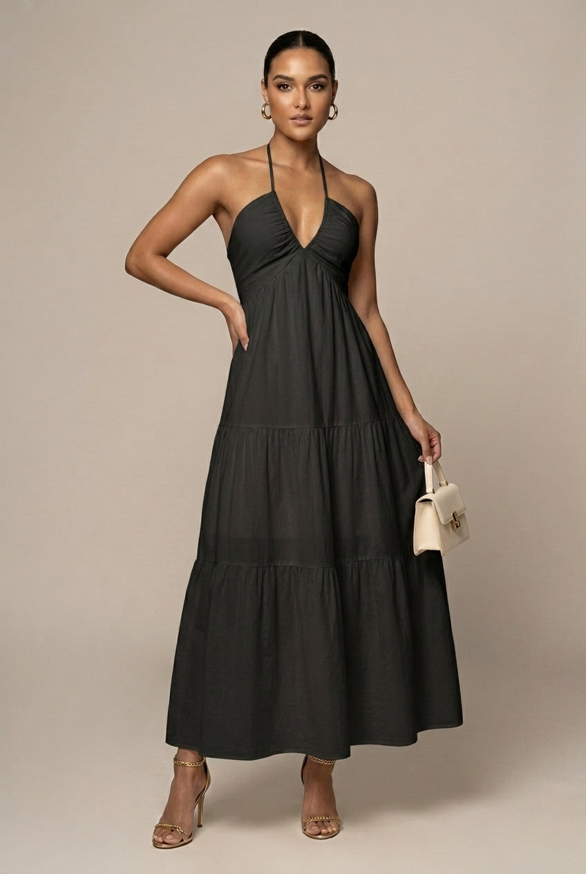 Elegant women's formal maxi dress with a sophisticated halter neck, tiered ruffles, and alluring open back design.