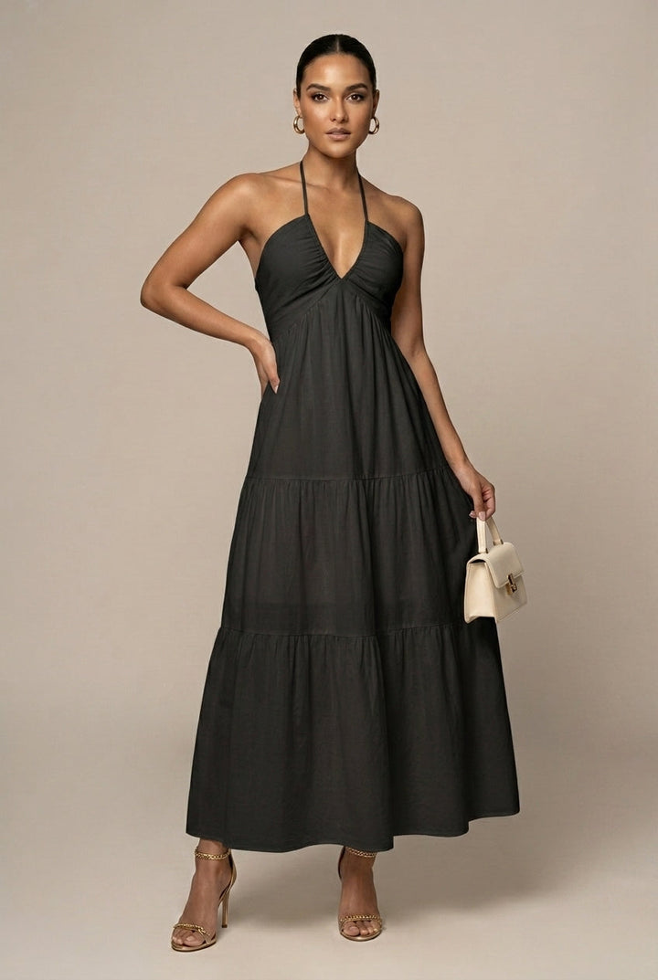 Elegant women's formal maxi dress with a sophisticated halter neck, tiered ruffles, and alluring open back design.