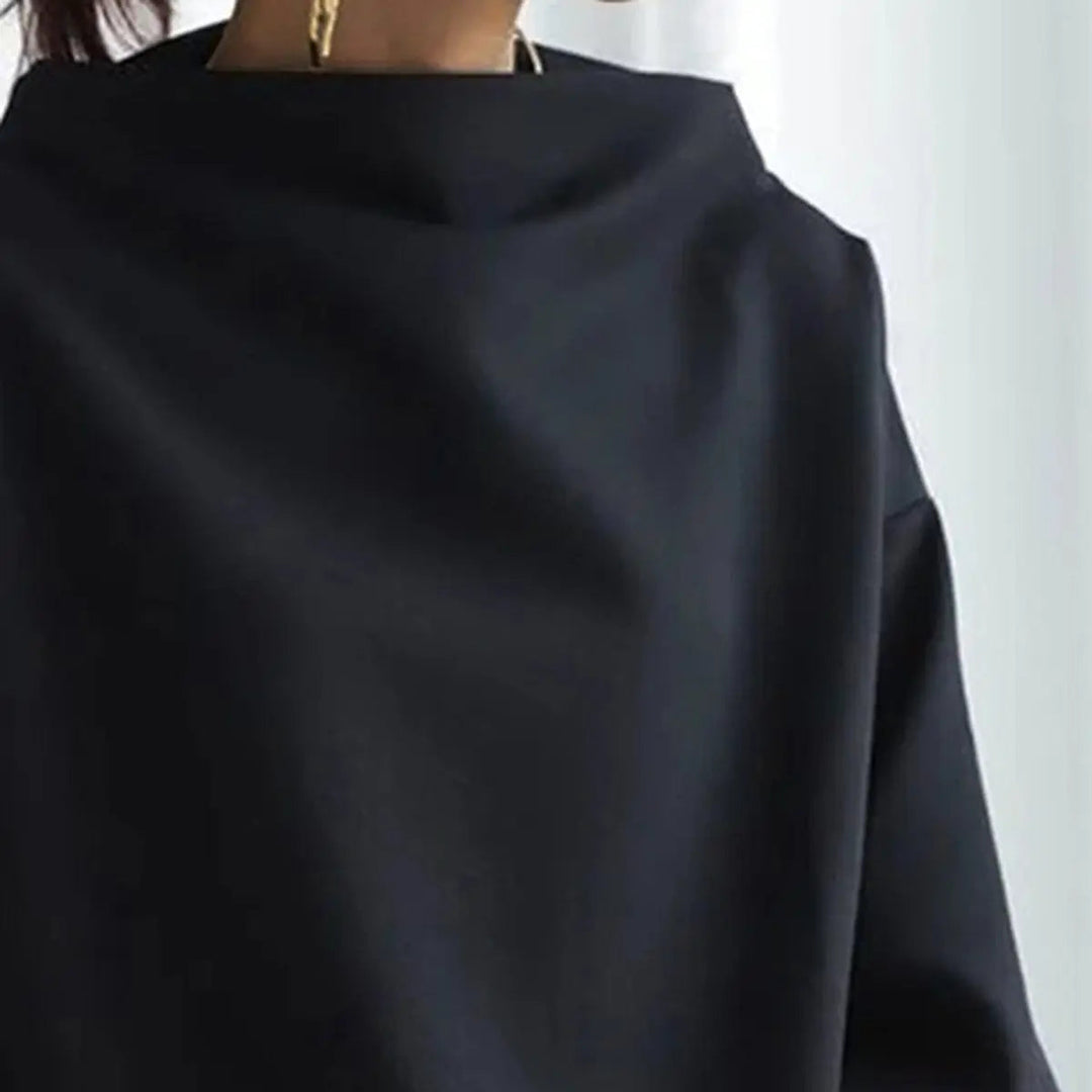 Blue sophisticated high-neck women's top. Classic long-sleeve design for an elegant look.