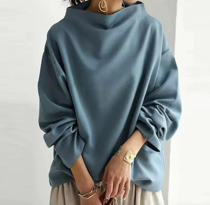 Classic women's high-neck top. Elegant long-sleeve design, perfect for sophisticated and chic outfits.