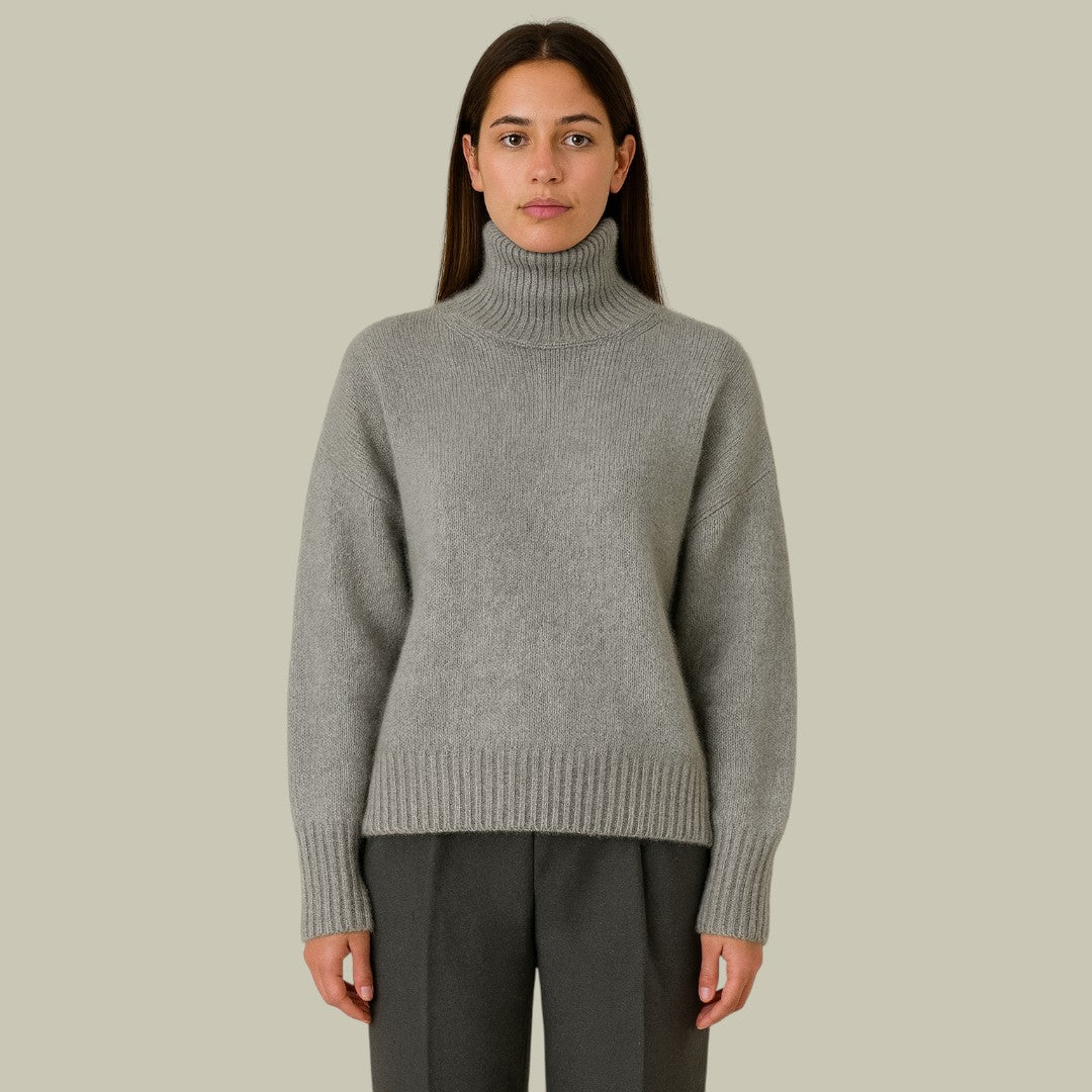 Elegant women's high neck merino wool sweater in a relaxed fit, perfect for winter wear.