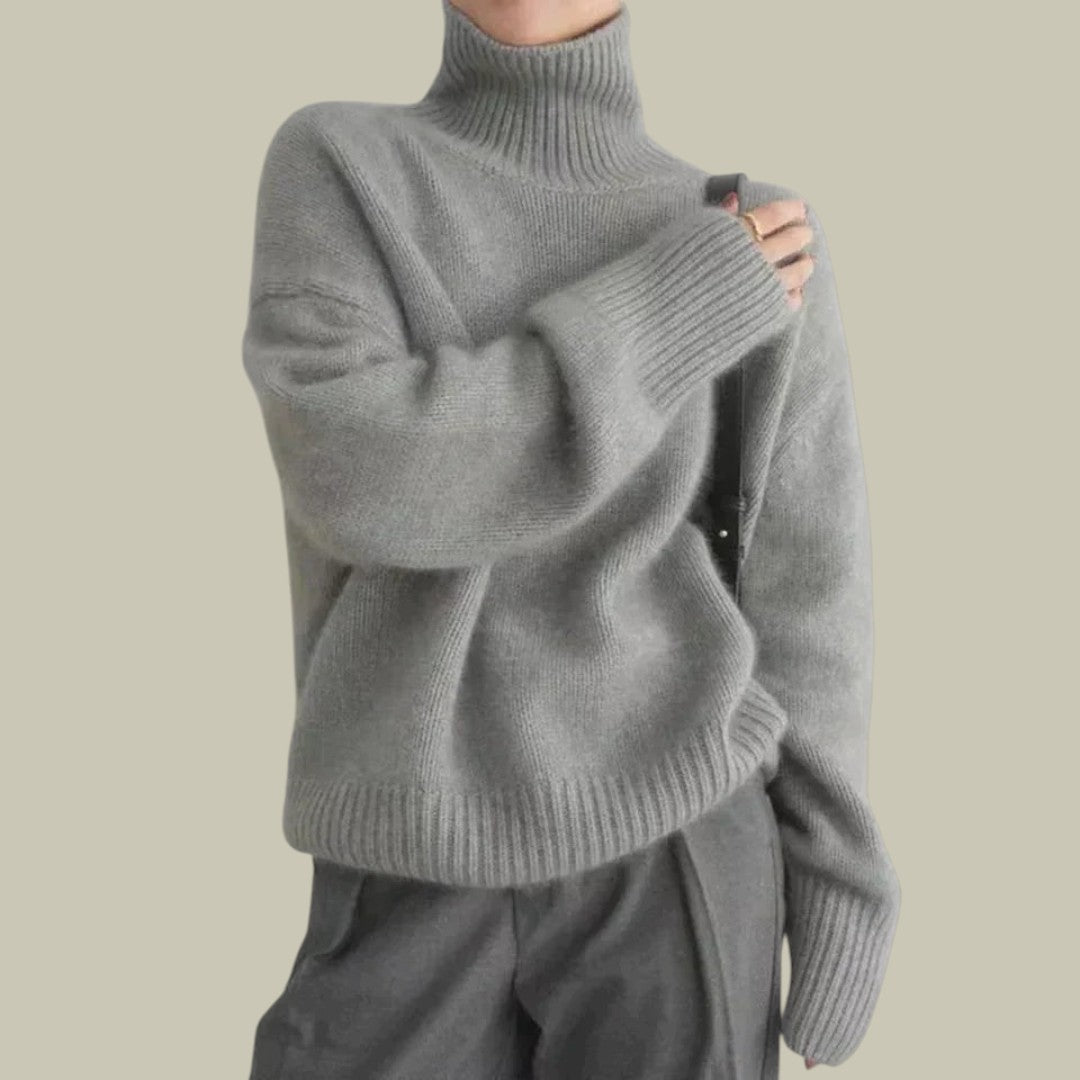 Relaxed fit high neck merino wool sweater for women, showcasing cozy and elegant winter wear.