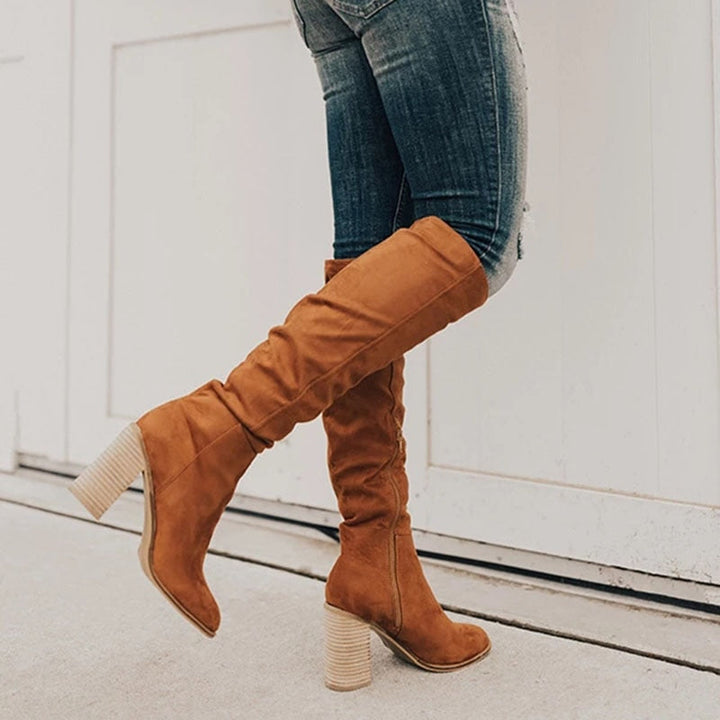 Elegant women's knee-high boots in a chic fall style. Perfect tall boots with a comfortable block heel.