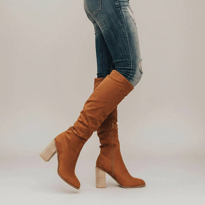 Elegant women's knee-high boots with comfortable block heel & pointed toe for fall/winter fashion. Side zipper design.