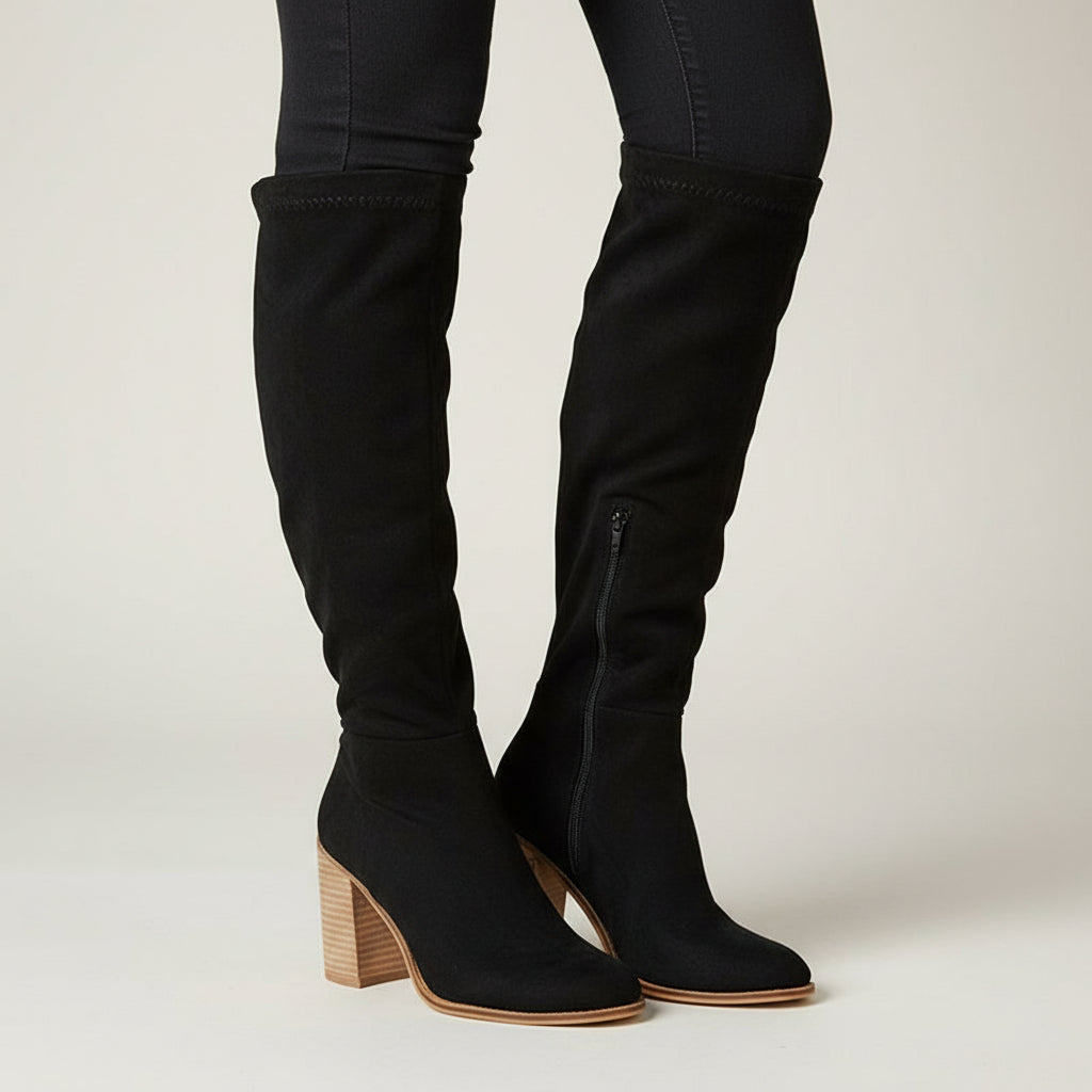 Fashionable women's knee-high boots with sturdy block heel, sleek pointed toe & practical side zipper. Elegant winter footwear.