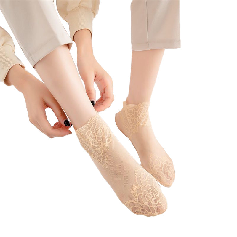 Elegant women's lace trim mesh ankle socks in a neutral tone, versatile and fashionable.