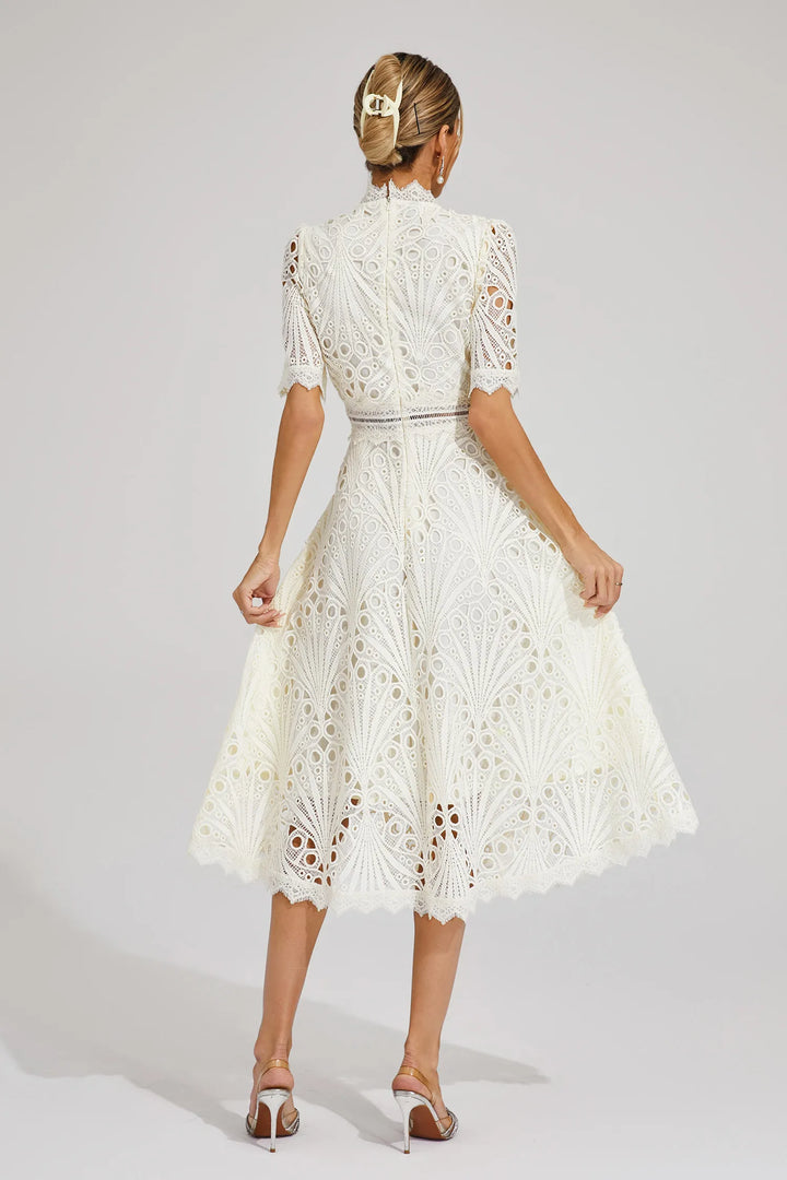 Beautiful women's event attire: elegant lace midi dress with scoop neck, perfect for parties.