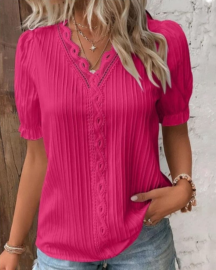 Feminine lace v-neck blouse for women, featuring elegant floral patterns. A versatile top for sophisticated fashion.