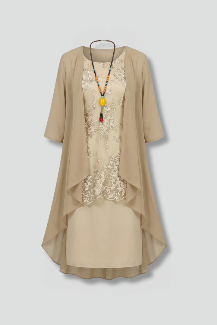 Elegant women's layered dress with sheer overlay, round neck, & short sleeves. Perfect knee-length cocktail attire.