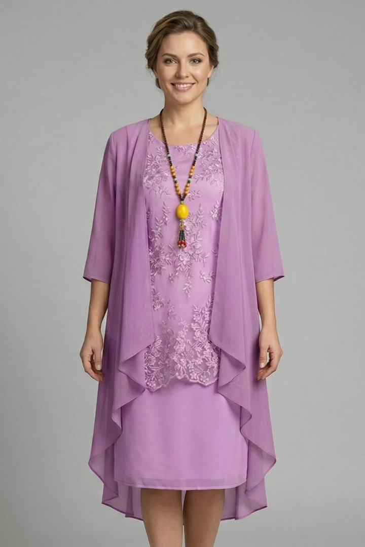 Women's elegant layered dress, knee-length, with a sheer overlay, round neck, and short sleeves. Perfect for events.