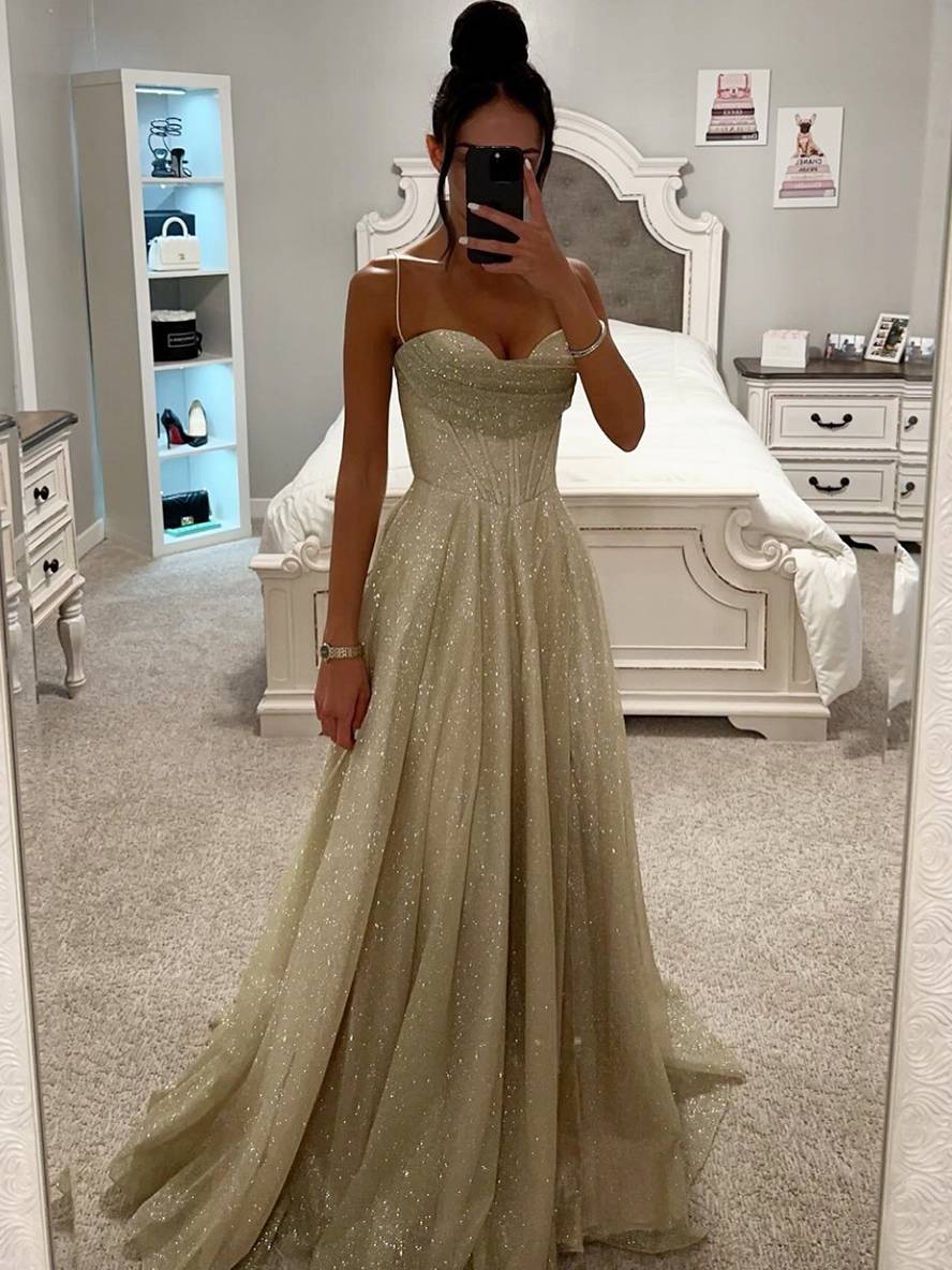 Elegant women's light pink maxi dress with long sleeves and open back, perfect for evening or formal events.