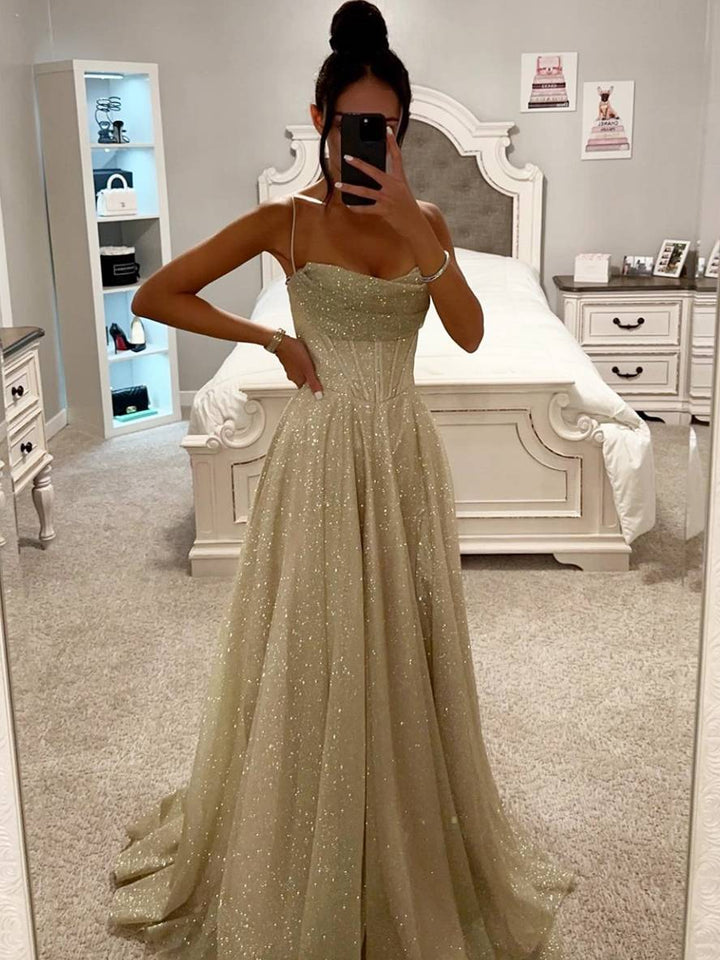 White formal maxi gown with elegant long sleeves and alluring open back for special occasions.