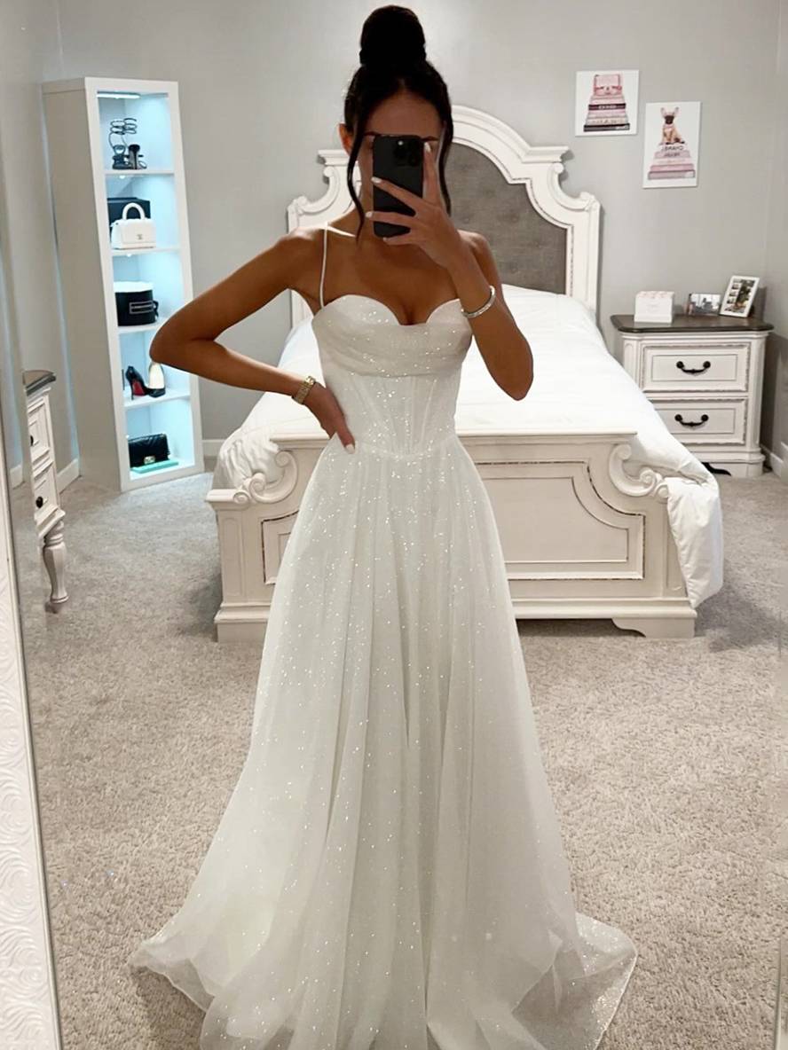 Prom-ready elegant beige maxi dress with long sleeves and stylish open back, perfect for a special event.